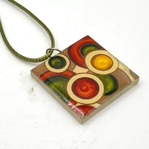 Rare Signed Artisan Ka Dea Abstract Art Diz Red Resin Pendant on a Green Cord
